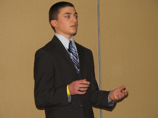 IMG_6718.JPG - Saturday afternoon the Delegates Caucus’ are held where candidates for Capital District offices present their qualifications and answer questions from the floor for the positions of Key Club Governor, Treasurer, Secretary, Editor, and International Trustee to the club delegates.  With over 900 Key Clubbers, multiple caucus rooms by divisions are lined up.  Competition is strong and spirited.  Alek Burkard, candidate for Treasurer from the Fishburne Military Academy addresses a caucus.  He won!  ALL competitors learn and grow by competing.