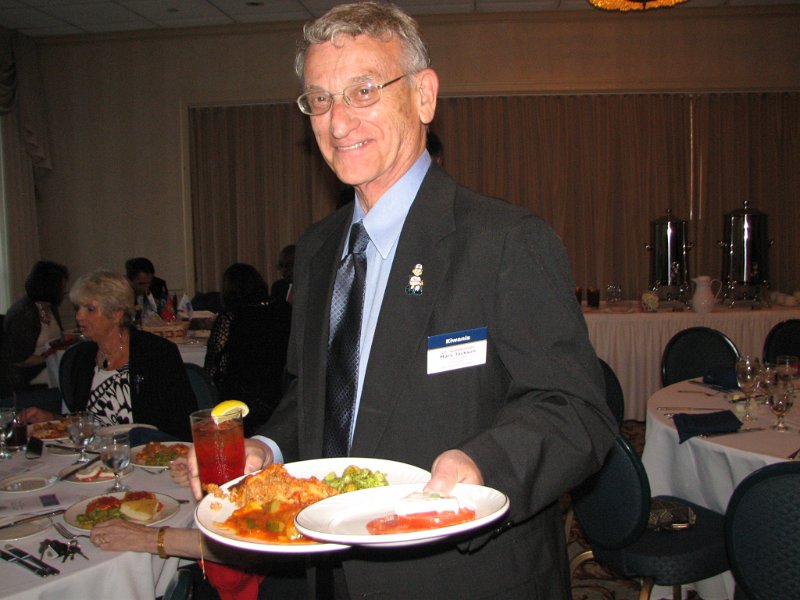 IMG_7768.JPG - A little side bar is seeing how the skilled handle the buffet line with ease and grace.  Division 17 Lieutenant Governor Marv Jackson demonstrates the ‘one hand, two plate shuffle’ while holding an iced tea with the other hand.  This takes some practice so you don’t make a big splash of yourself.  Good job, Marv.  Thanks for coming to the event!