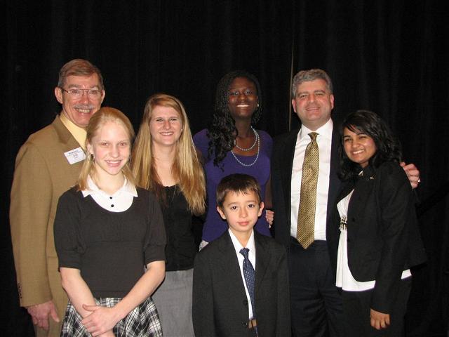 IMG_6408.JPG - Remarks from K-Family Leaders at the Kiwanis Family Breakfast Saturday morning.  From the left:  Kiwanis Governor Don Dudey, Jessica Schuler Westminster Builder’s Club, Emilie Pinto on Key Leader from Warhill High School, Enrique Crank-Brock Arlington Traditional School K-Kids Club, Capital District Key Club Governor Samah McGona, Kiwanis International President Paul Palazzolo, and Capital District CKI Governor Avanti Kollaram.