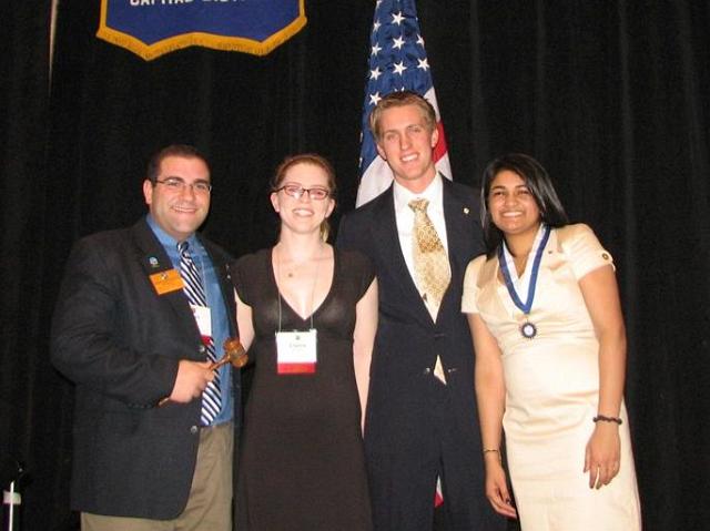 IMG_6569.JPG - It is tradition that the CKI Governor’s official banner is transferred at this time from 2008-2009 Governor Avanti Kollaram to 2009-2010 CKI Governor Brian Cofrancesco.  The CKI club presidents transfer the banner from Virginia Commonwealth University to the University of Virginia where it will be displayed at each meeting.  That is as soon as they can get it down from the 15’ curtain where it has been for the convention.  No problem.  Thanks to you and your teams for serving CKI and the K-Family.
