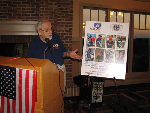 IMG_9266.JPG - Last but not least of the “Happenings in September” in Division 17, the Bethesda Kiwanis Club held its major fund raiser.  It’s the “37th Annual Bethesda Kiwanis Golf Classic” at the Bretton Woods Club in Germantown benefiting Suburban Hospital and its other charities.  Club President and PLG Jim Leder begins the awards and silent auction dinner with a pitch on the Miracle League Baseball project.  This is a very ambitious project needing equally ambitious fund raising.  The M.L. is a special baseball field designed for physically and/or otherwise disabled children.  It is the first such field in Maryland. An exhibition game was played also for the first time on August 28th at the Montgomery County Soccer Plex in Germantown.  For more information on the project please go to the site www.miracleleaguemontcomd.com.