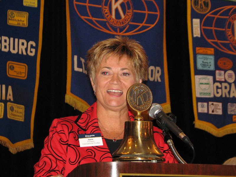 IMG_5104.JPG - We of course had a spirited singing of our National Anthem, then an excellent morning buffet breakfast, followed by very welcoming comments by Mary Jones, Chair, James City Board of Supervisors and the by Clyde Haulman, Mayor, City of Williamsburg. Next was ‘Patrick Henry’ keeping in the Colonial Spirit as shown in the previous photo. Official Greetings come from our Kiwanis International Trustee and Counselor to the Capital District Jane Erickson. We have really been fortunate to have Jane as our advisor. She was newly elected as KI Trustee at the KICON in Geneva. Among many other Kiwanis positions she is a Past Governor of the Nebraska-Iowa District and a past KIF International Trustee. You can see by the sparkle in her eyes the confidence, wit and humor she has brought on previous visits and will bring us during her year as our counselor. Welcome, Jane Erickson!